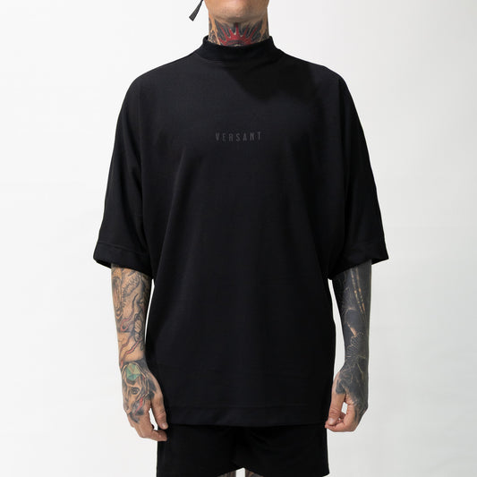 Batwing Oversized Tee front view by Versant Studios on model with tattoos
